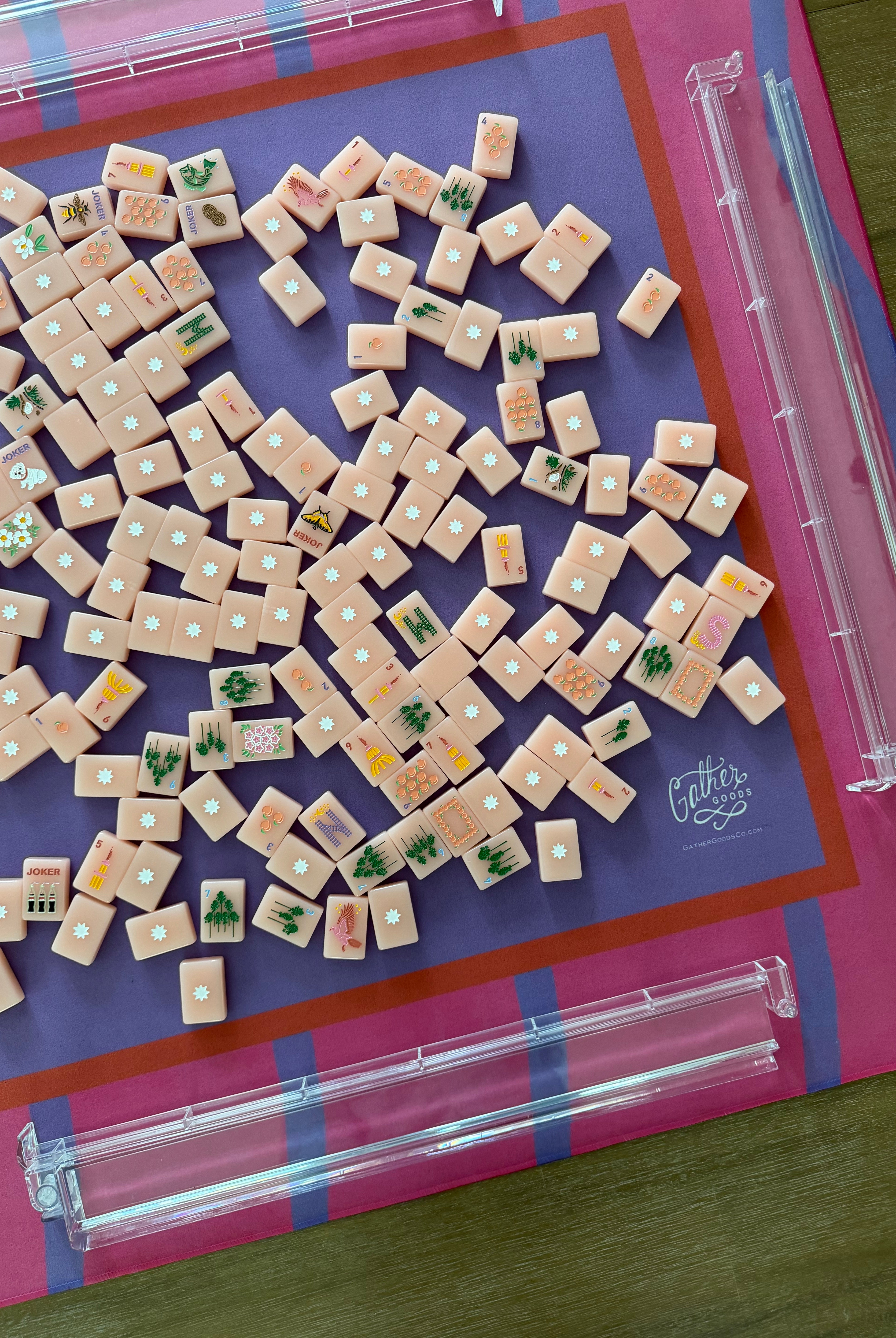Maximalist hot pink and lavender wavy stripe mahjong mat with tiles