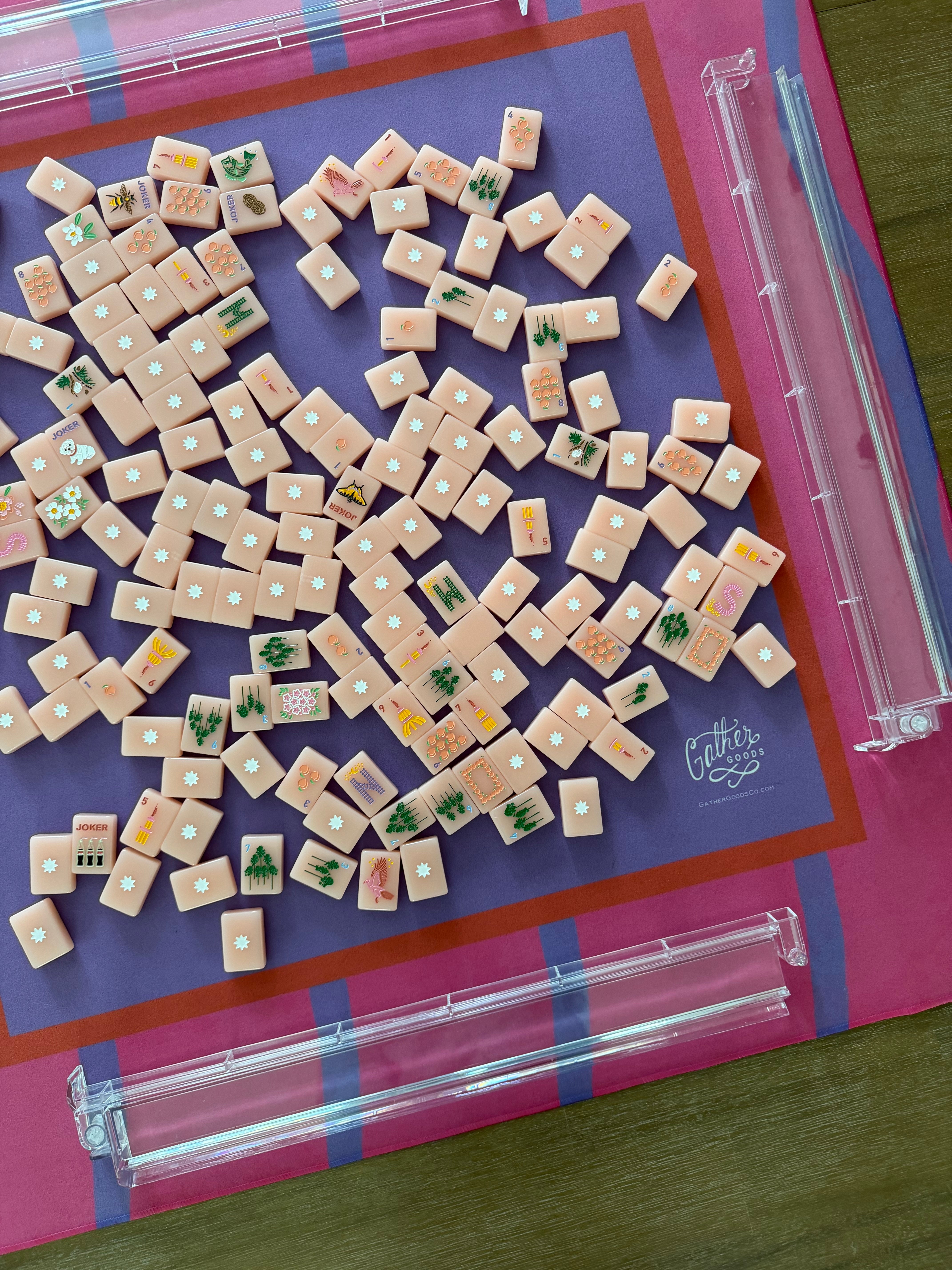 Maximalist hot pink and lavender wavy stripe mahjong mat with tiles