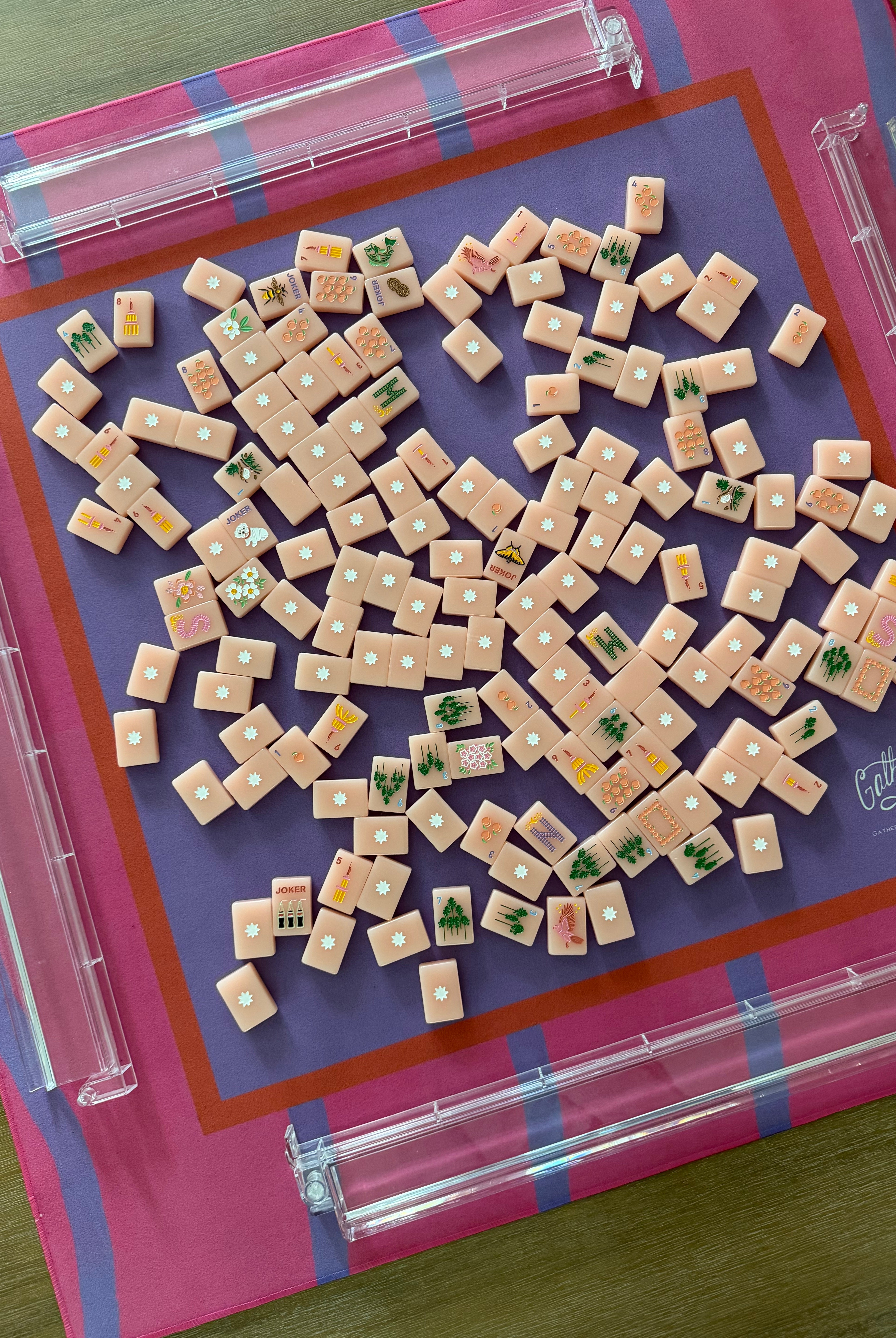 Maximalist hot pink and lavender wavy stripe mahjong mat with Pretty Mahjong Tiles