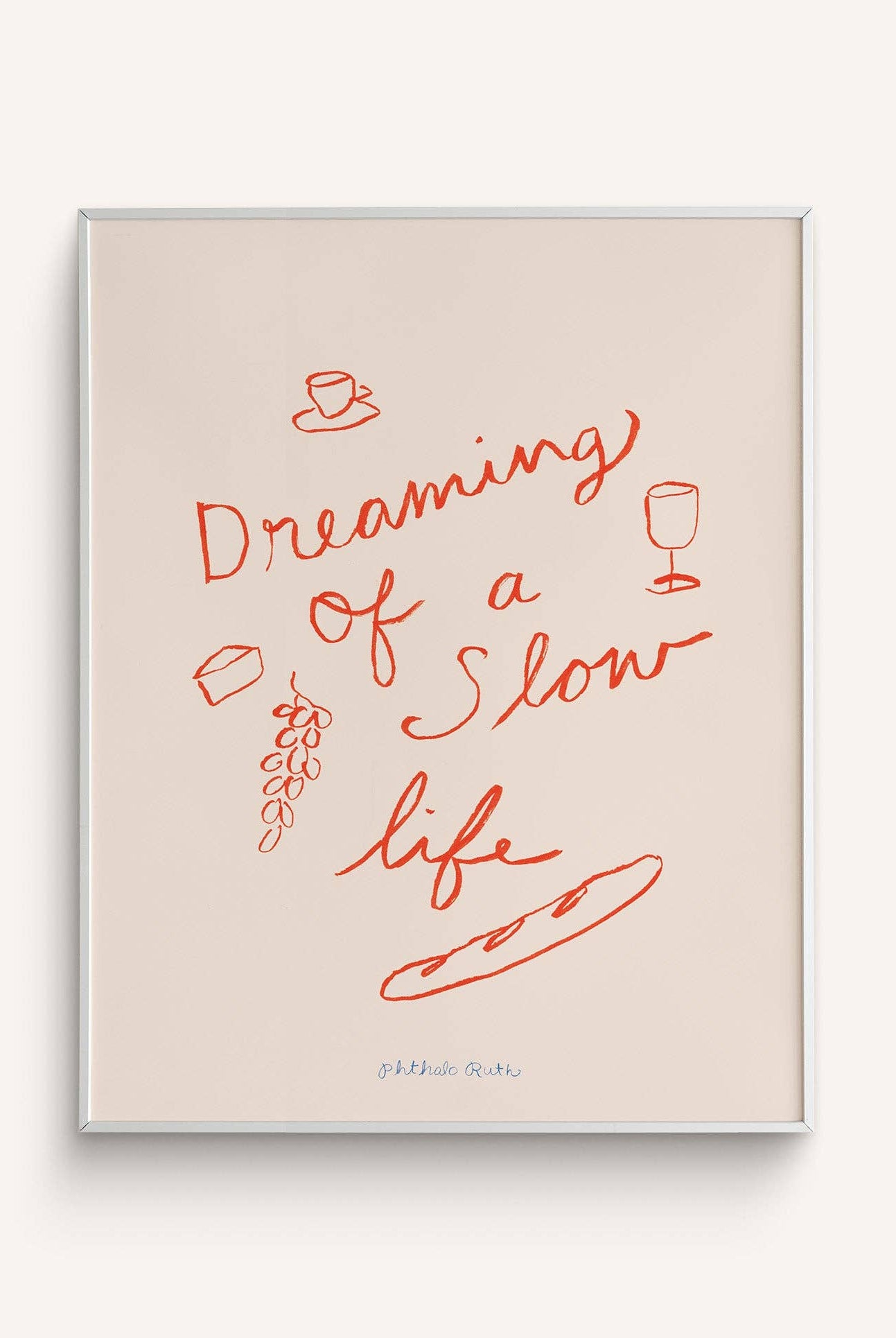 A beige art print with red text and illustrations of wine glasses and snacks, titled 'Dreaming of a Slow Life'.