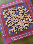 Maximalist hot pink and lavender wavy stripe mahjong mat with Pretty Mahjong Tiles