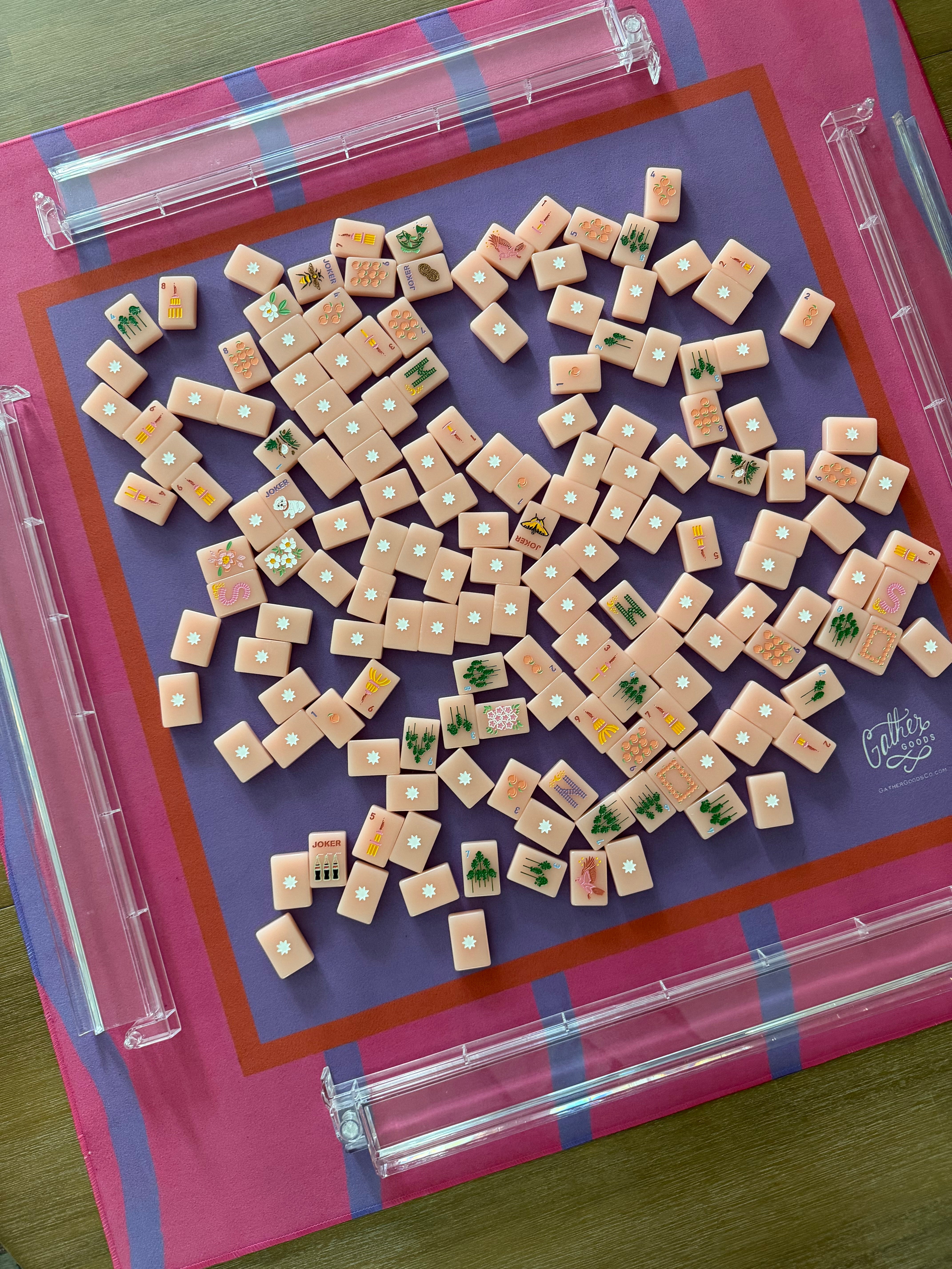 Maximalist hot pink and lavender wavy stripe mahjong mat with Pretty Mahjong Tiles